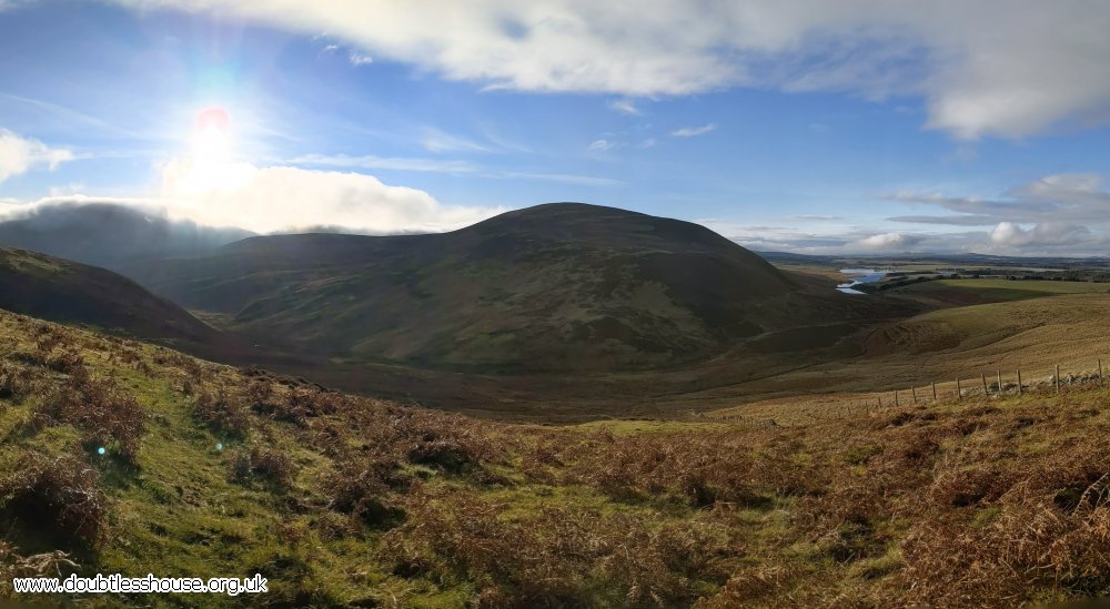 Panoramic view of hill, valley and reservoir